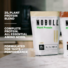 NOBULL Plant Protein tub front showing chocolate flavor and smooth mix.