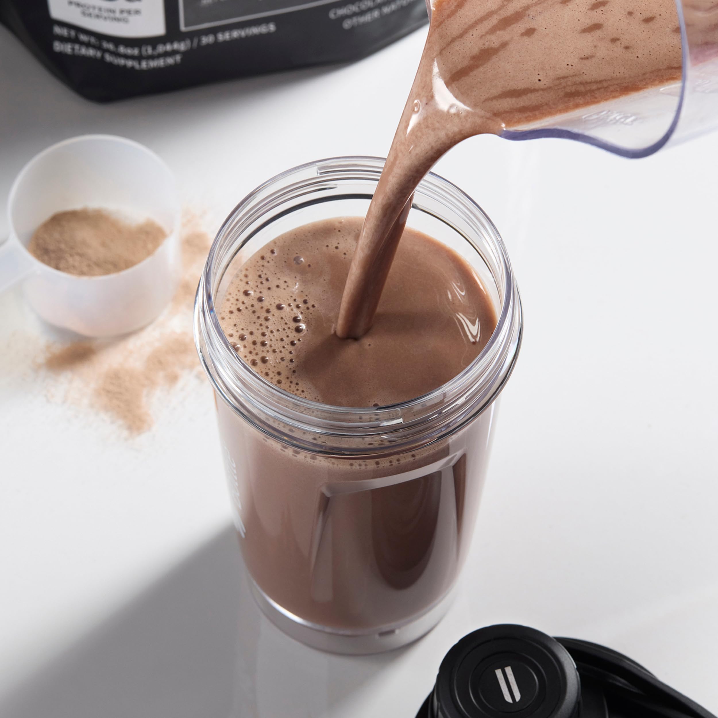 NOBULL Whey Protein Isolate shake image shows smooth mixing and palatable chocolate flavor.