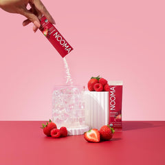 NOOMA electrolyte mix being poured into a glass for fast hydration