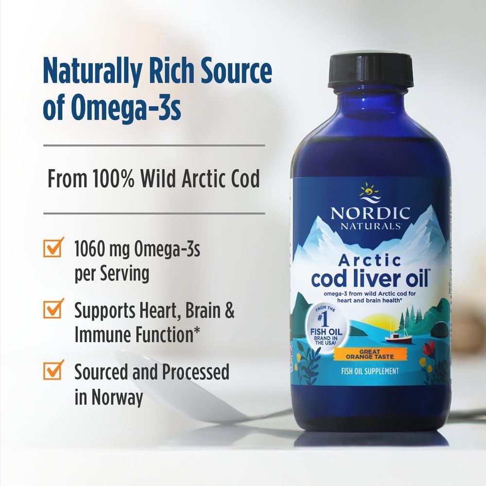 Nordic Naturals Arctic Cod Liver Oil orange bottle on kitchen counter—quick daily omega-3 supplement.