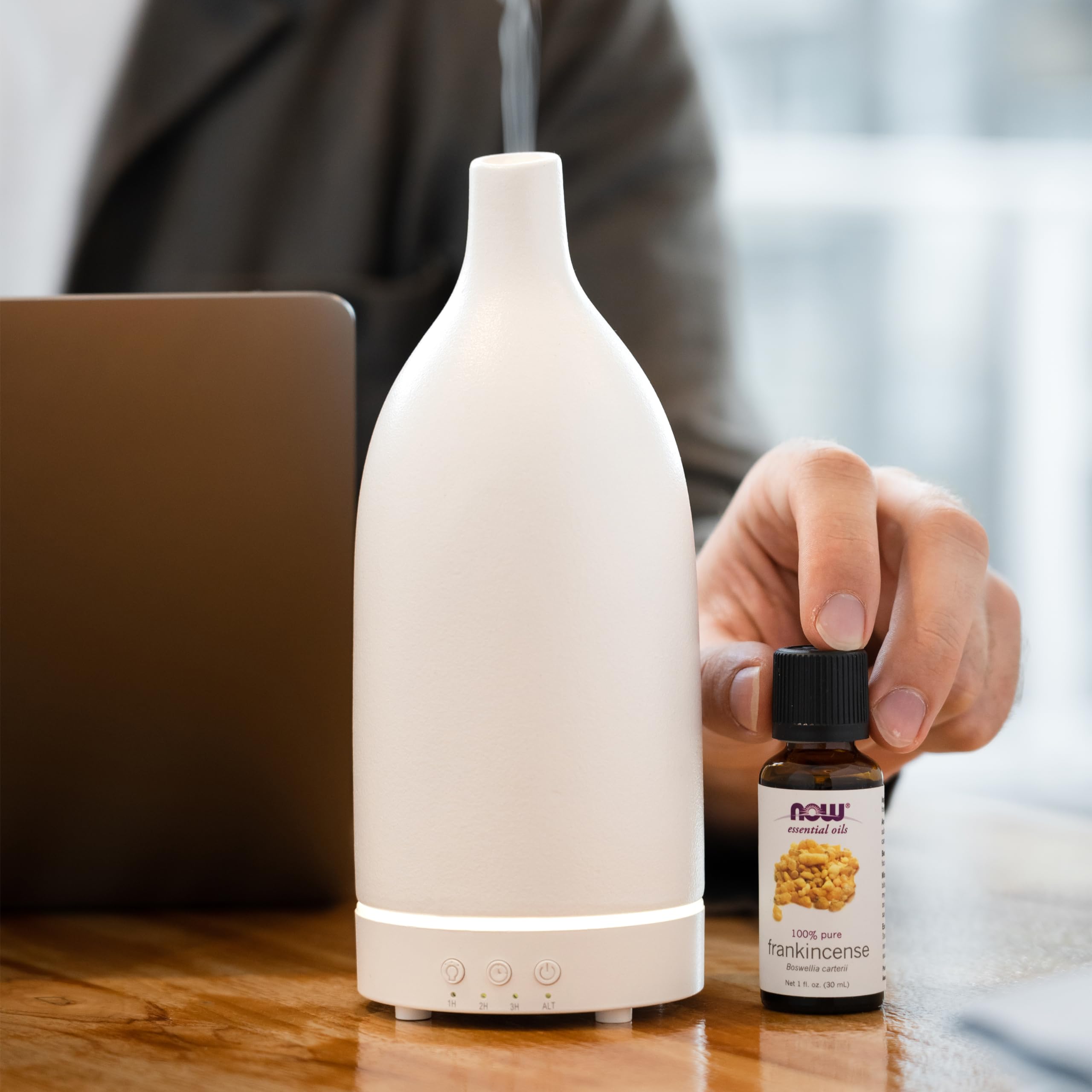 NOW Foods Frankincense oil room-diffusion scene promotes focused, centering ambiance.