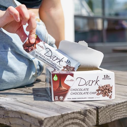 Nugo Dark Mint Chocolate Chip bars closeup, rich chocolate coating and chewy center.