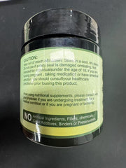 Nukupuns bottle on a table with capsules ready for daily intake.