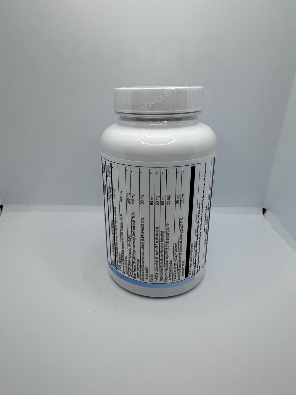 Nutra Biogenesis Diabetone Plus bottle pour captured for spill-free measurement.