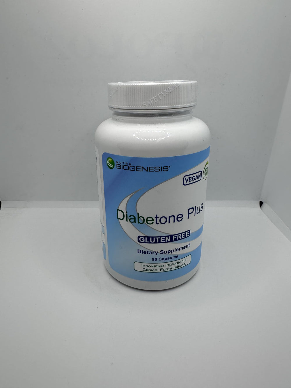 Nutra Biogenesis Diabetone Plus daily-use bottle demonstrates three-capsule serving.