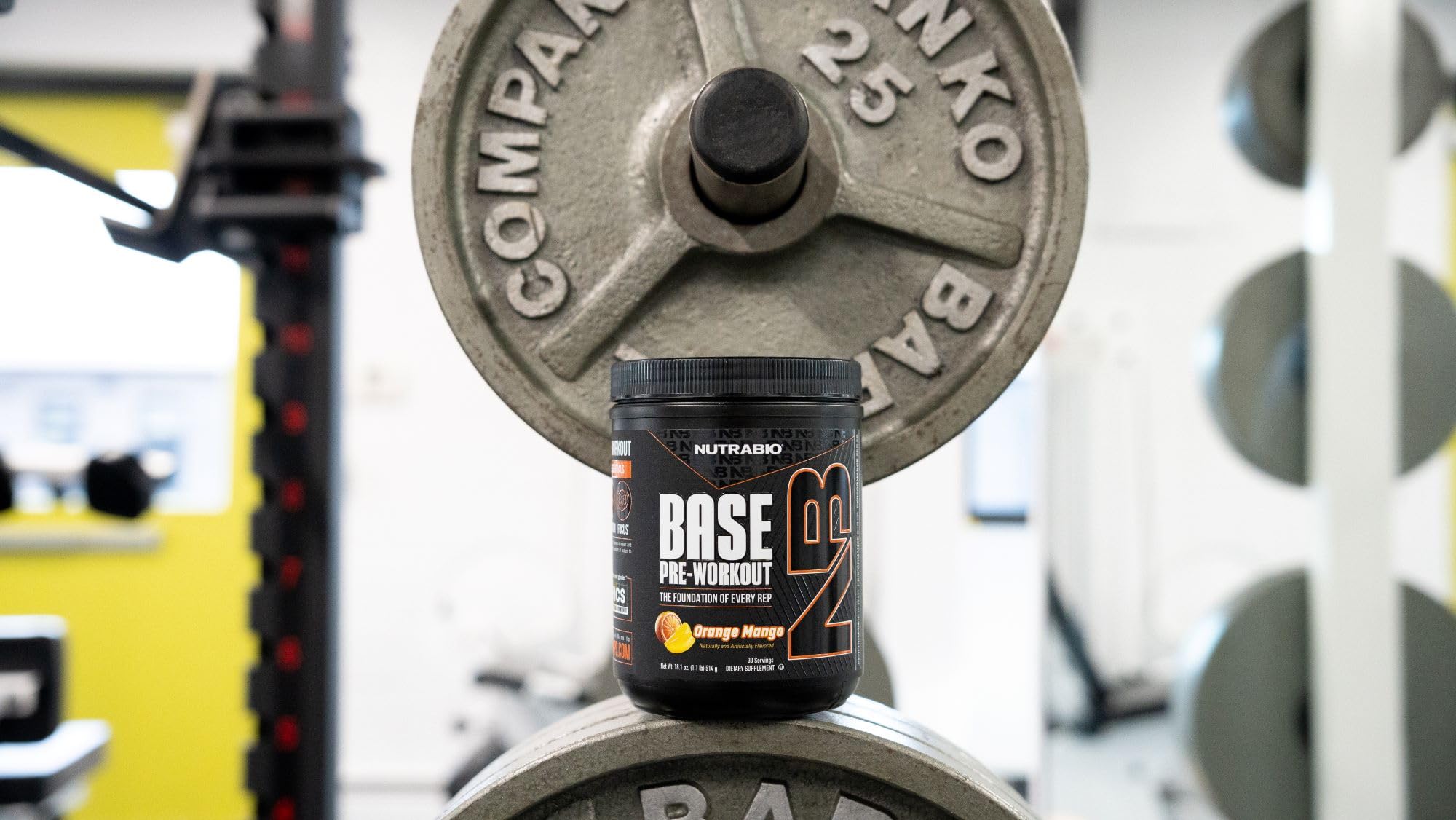 NutraBio Base Pre-Workout powder dissolving in water suggests quick hydration and flavor.