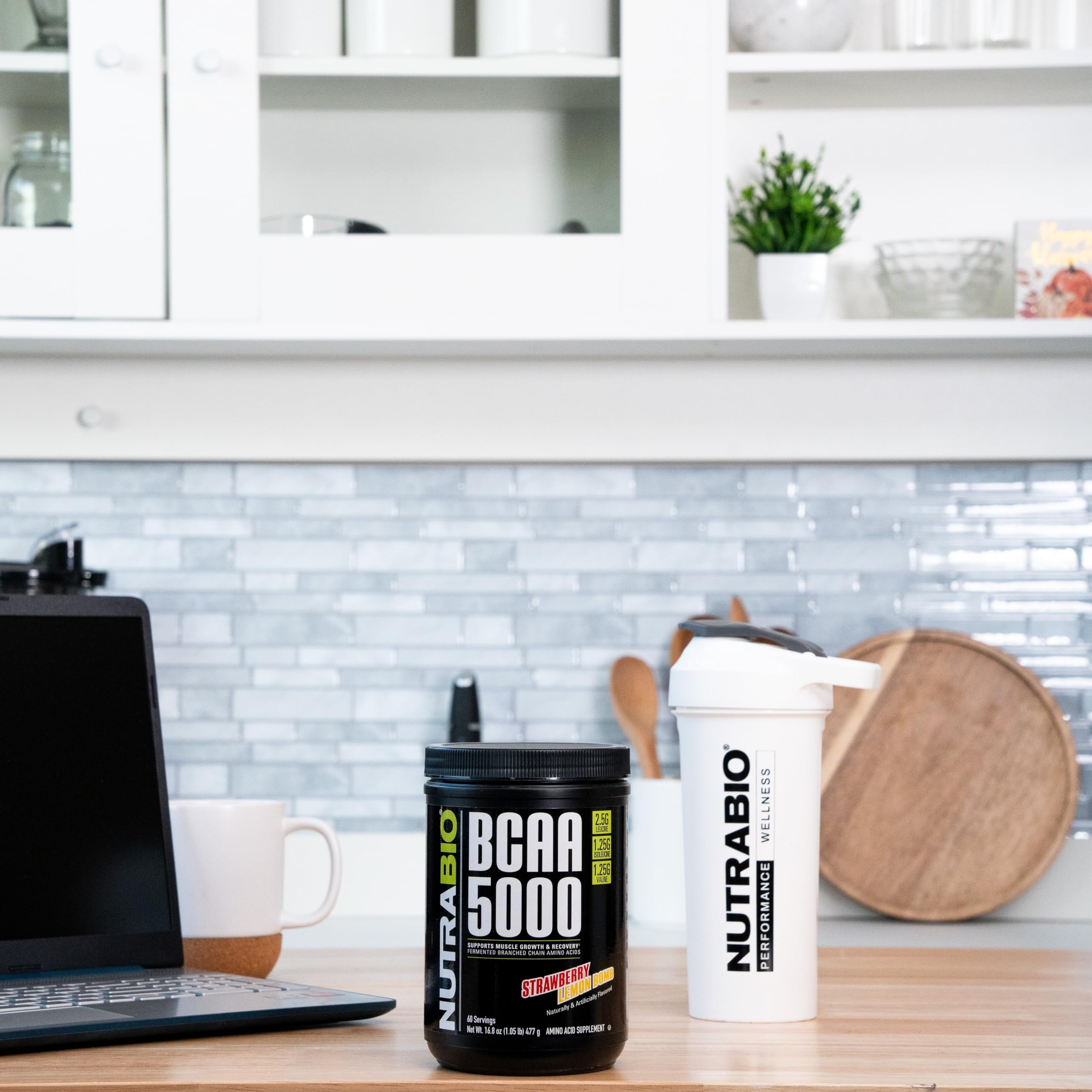 NutraBio BCAA 5000 gluten-free and non-GMO icons displayed on packaging.