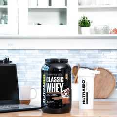NutraBio Classic Whey chocolate milkshake in a glass, creamy texture.