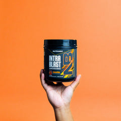 NutraBio Intra Blast powder dissolving in a glass of water