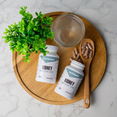 NutraBio Kidney Support dispensed capsules on a clean surface