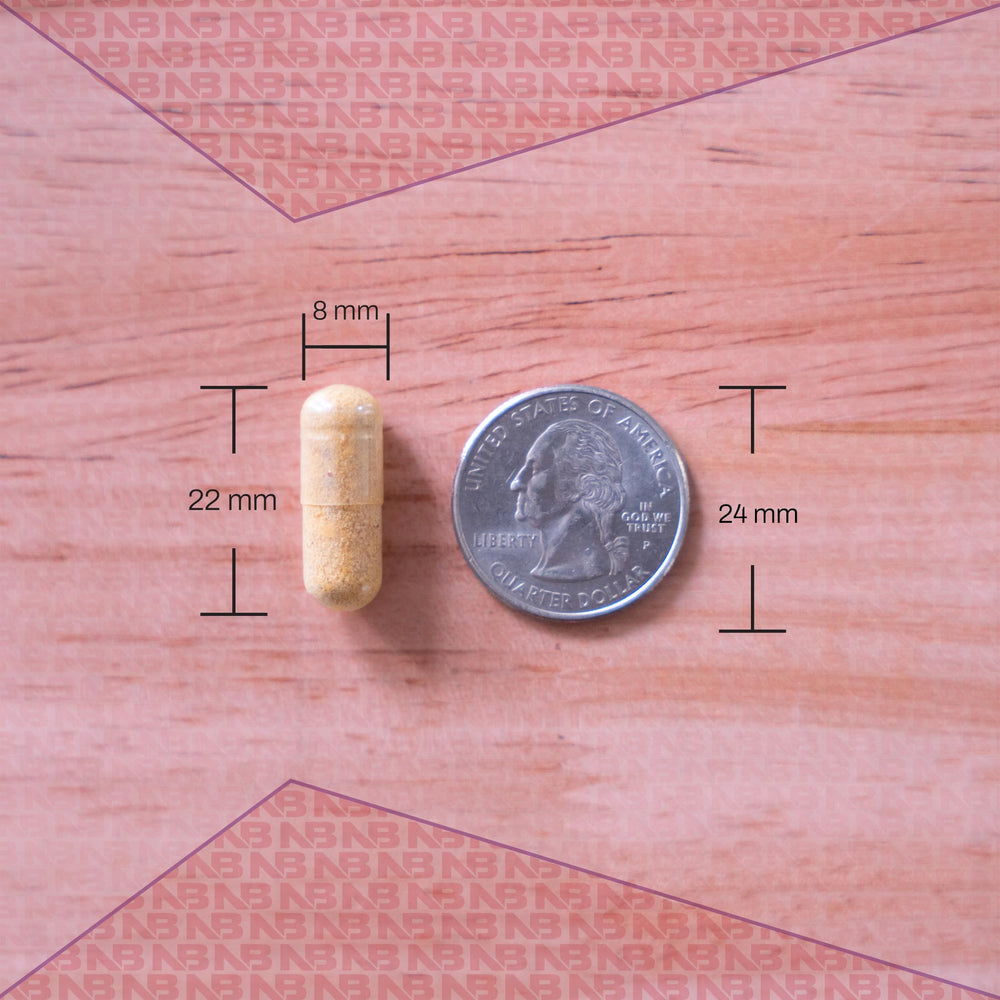 Close-up of a vitamin tablet shows non-GMO and allergen-free attributes.