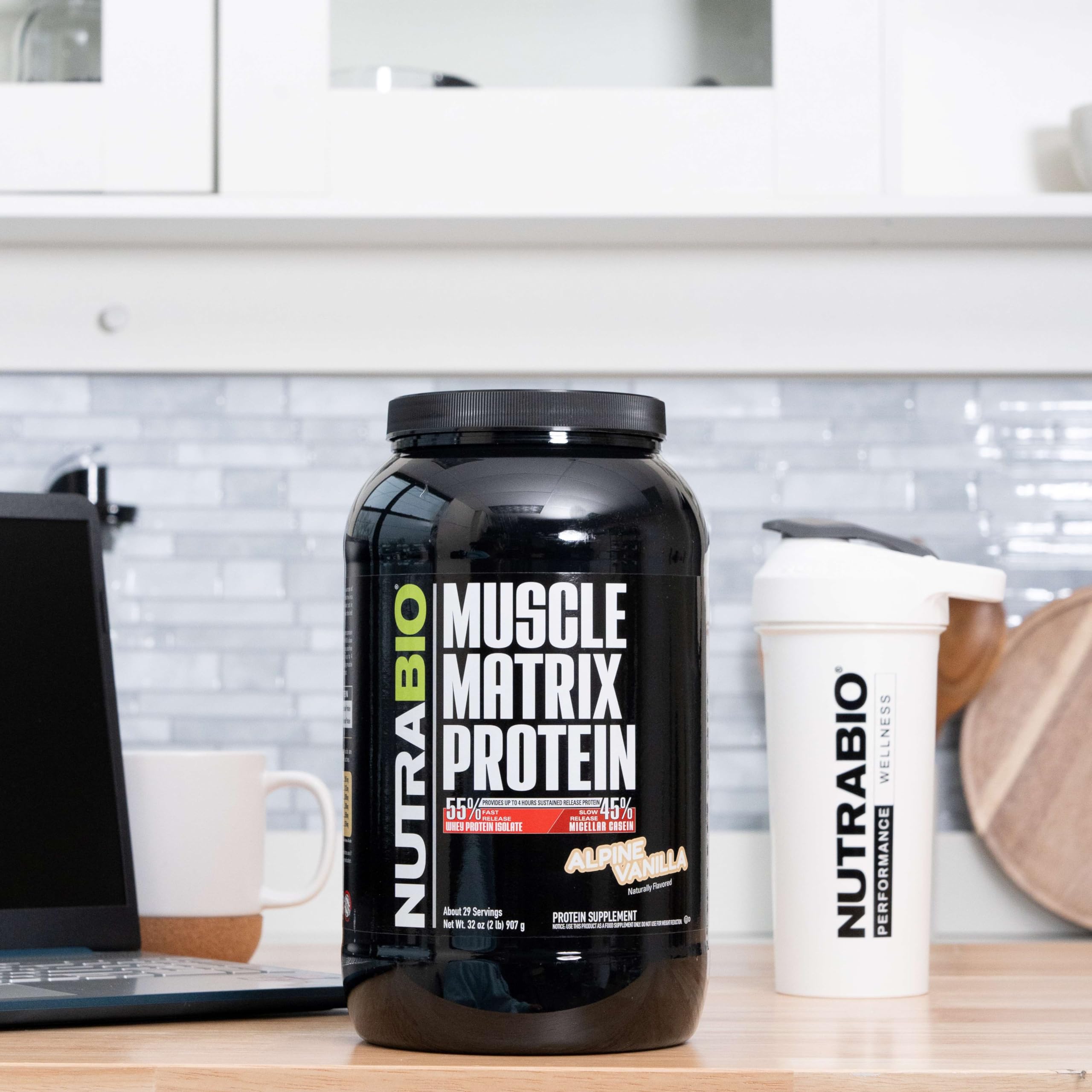 NutraBio Muscle Matrix scoop close-up showing powder texture for smooth mixing.