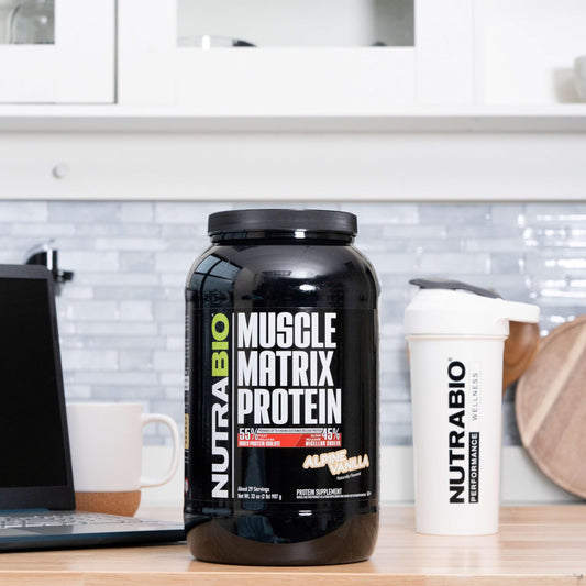 NutraBio Muscle Matrix scoop close-up showing powder texture for smooth mixing.