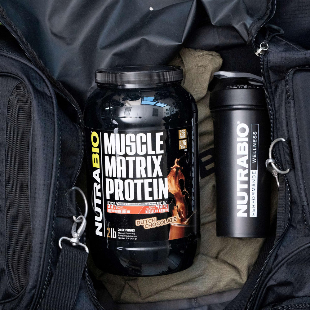 NutraBio Muscle Matrix scoop poured into a shake for quick protein delivery.