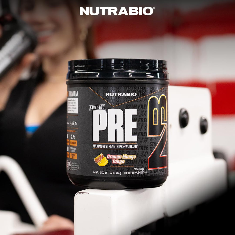NutraBio STIM-Free PRE drink glass on gym bench implying sustained hydration.