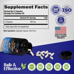 NutraHarmony L-Theanine capsules closeup with glass of water.