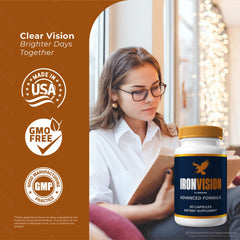 NutraVibe Iron Vision capsules resting beside a glass of water.