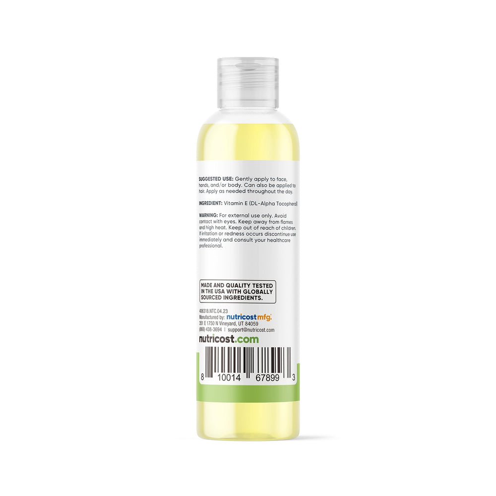 Applying Nutricost Vitamin E Oil to skin for hydration and conditioning.