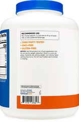 Smooth Nutricost pumpkin spice mix swirling in a glass for a smoothie