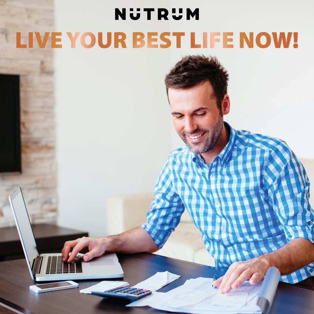 Nutrum Brain Booster on a desk beside a notebook for focused study