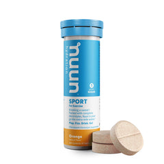 Nuun Sport Orange tablet dissolving in water for quick hydration during activity.