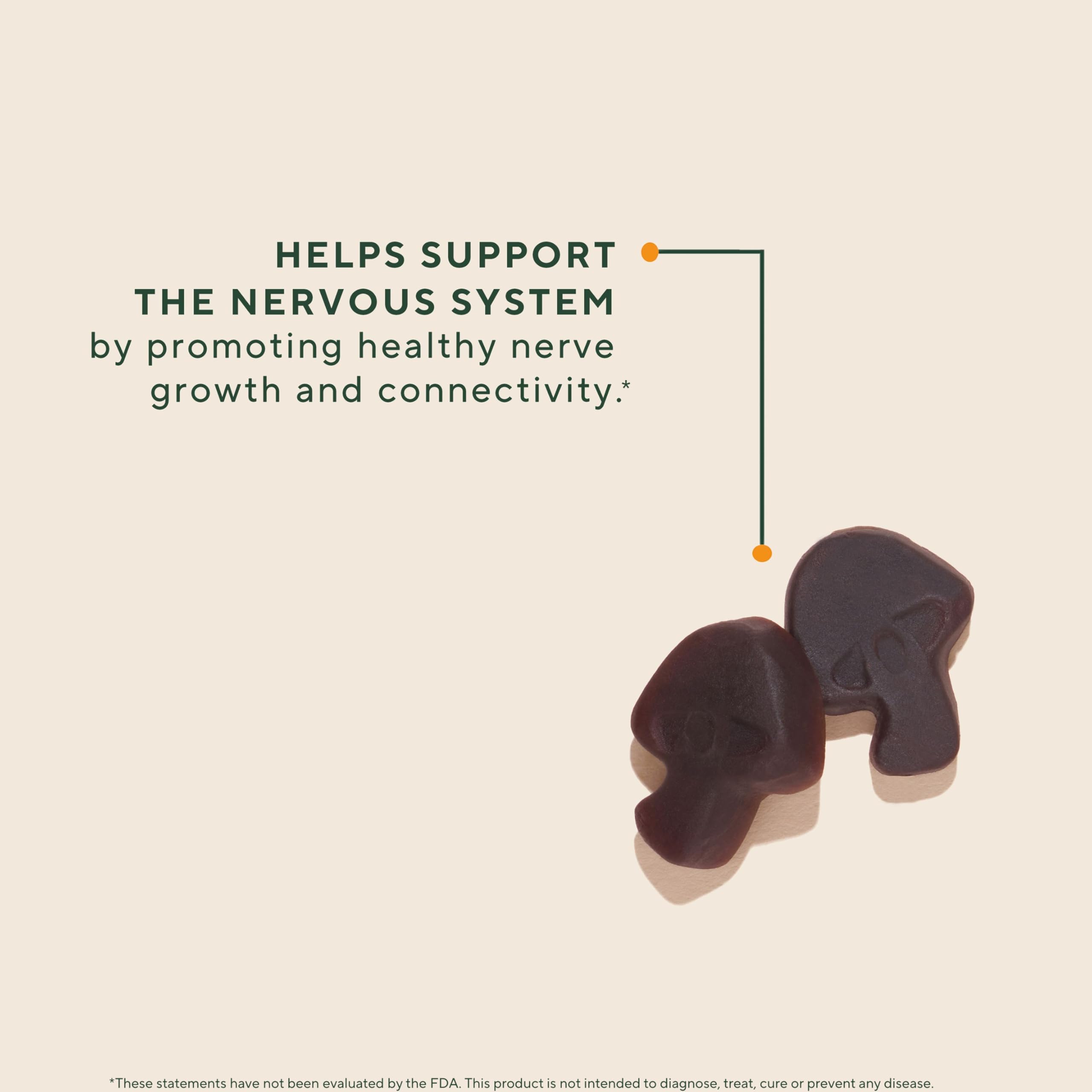 Close-up of Lions Mane Gummies texture with vibrant strawberry color for daily use.