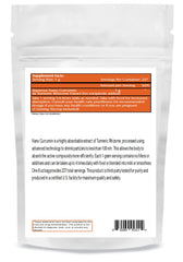 One Planet Nutrition Nano Curcumin Powder scoop beside a glass of tea.