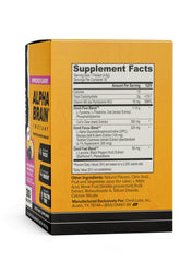 Pouring Alpha Brain Instant powder into a glass with blackberry lemonade flavor