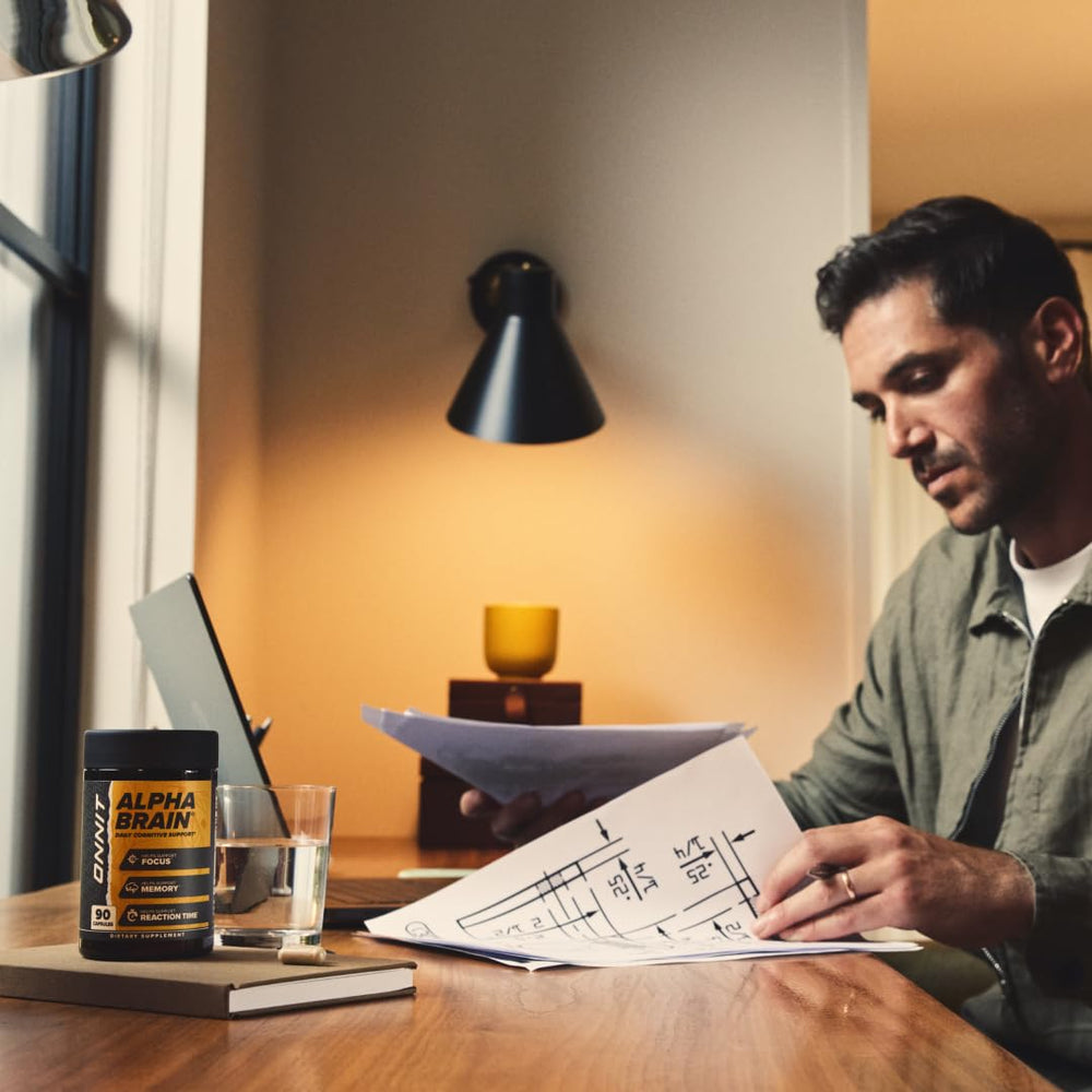 ONNIT Alpha Brain study-desk-scene illustrates focus during work or study sessions.