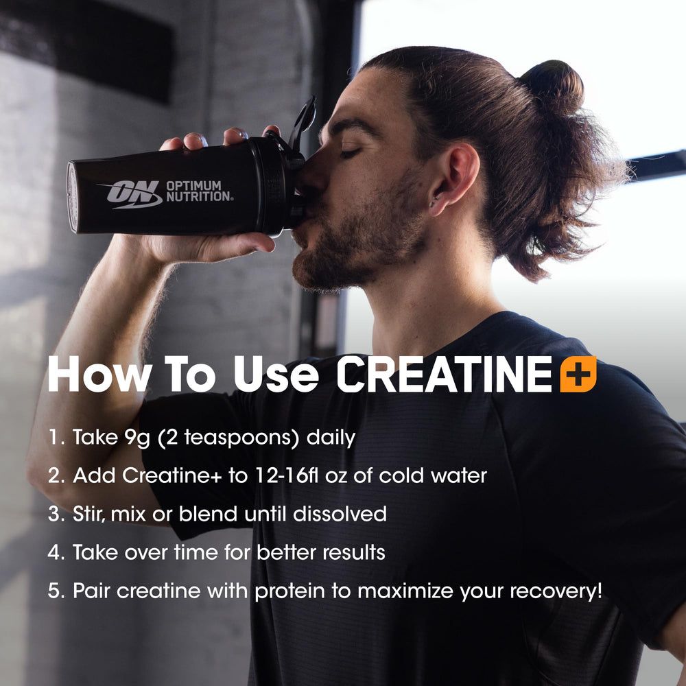 Optimum Nutrition Creatine Monohydrate Plus powder-dispense spoon in hand.
