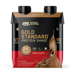 Cafe Latte shake poured into a glass suggests on-the-go protein with smooth texture.