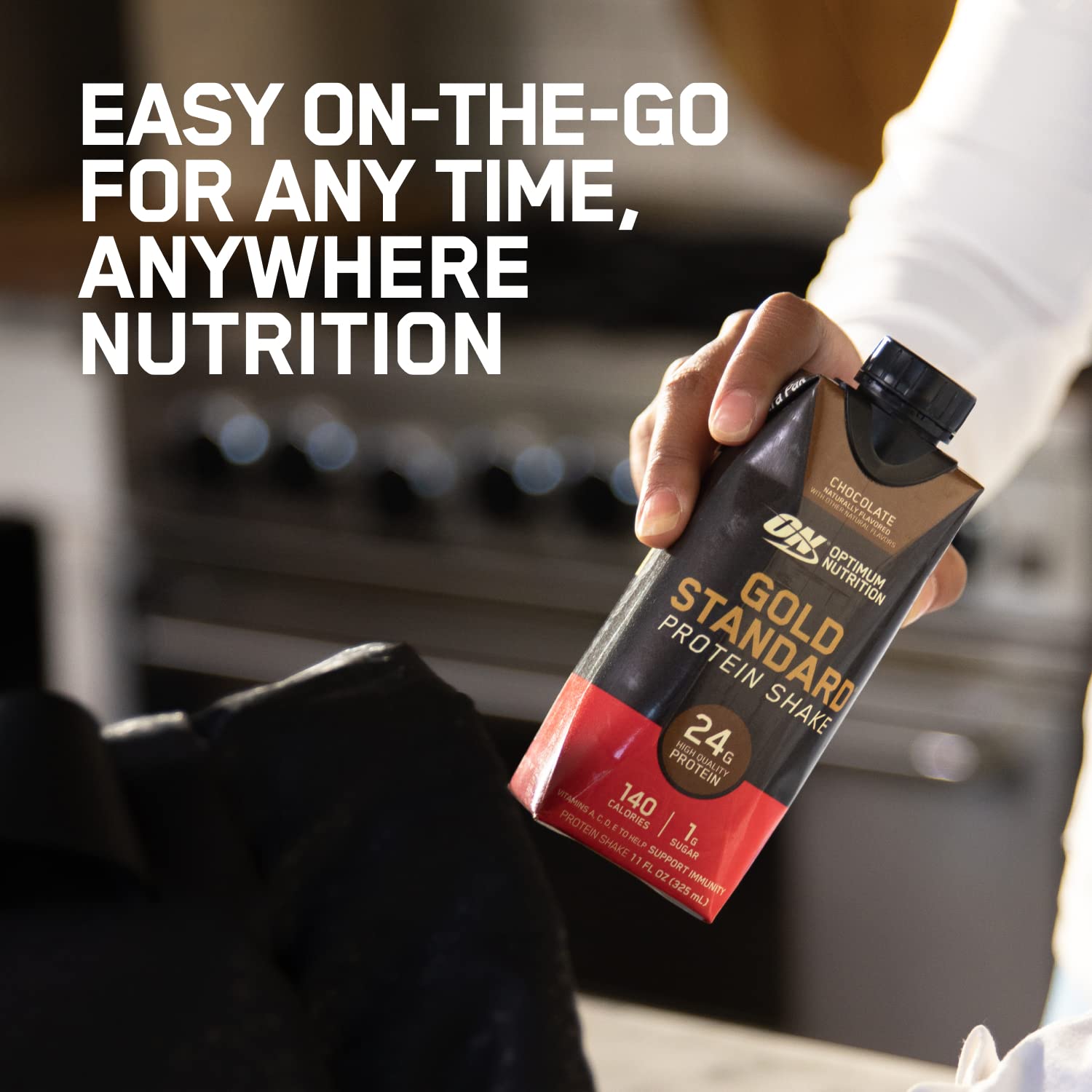 Close-up of chocolate flavor label on Gold Standard bottle highlighting protein content.