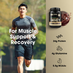 Optimum Nutrition Gold Standard whey powder pouring into shaker bottle.