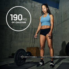 Optimum Nutrition Opti-Women bottle in gym setting for active lifestyle.
