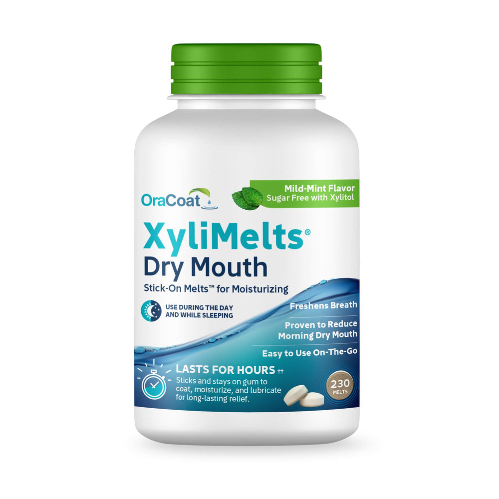 Oracoat XyliMelts discs on teeth providing long-lasting moisture.