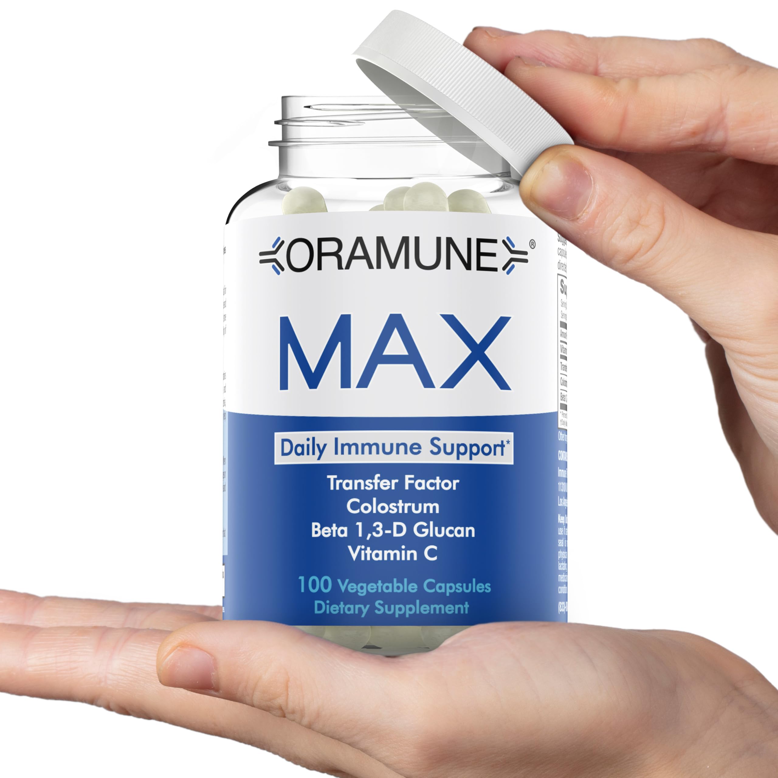 Oramune Max bottle label closeup highlights Transfer Factor and colostrum ingredients.