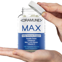 Oramune Max bottle label closeup highlights Transfer Factor and colostrum ingredients.