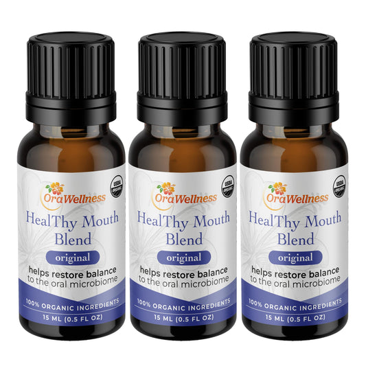 OraWellness Healthy Mouth Blend bottle pour for easy oil pulling and fresh breath.