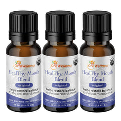 OraWellness Healthy Mouth Blend bottle pour for easy oil pulling and fresh breath.
