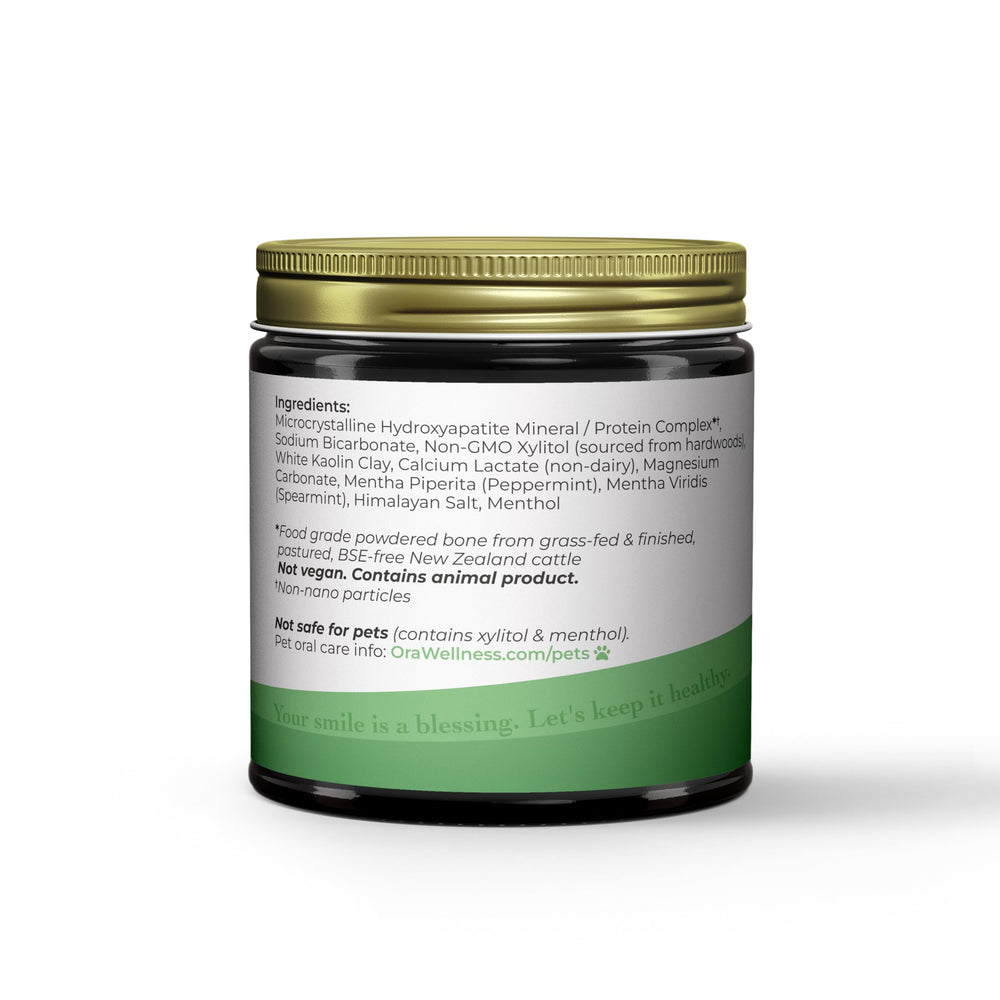 OraWellness Shine powder for daily use shown on a damp toothbrush