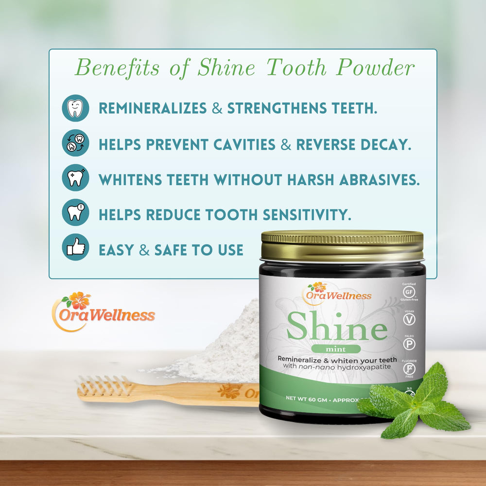 OraWellness Shine tooth powder on brush demonstrates simple daily whitening application