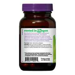 Oregon's Wild Harvest turmeric supplement label on bottle, non-GMO verified.