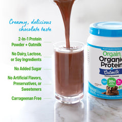 Orgain chocolate protein oatmilk shaker with glass ready for a quick meal