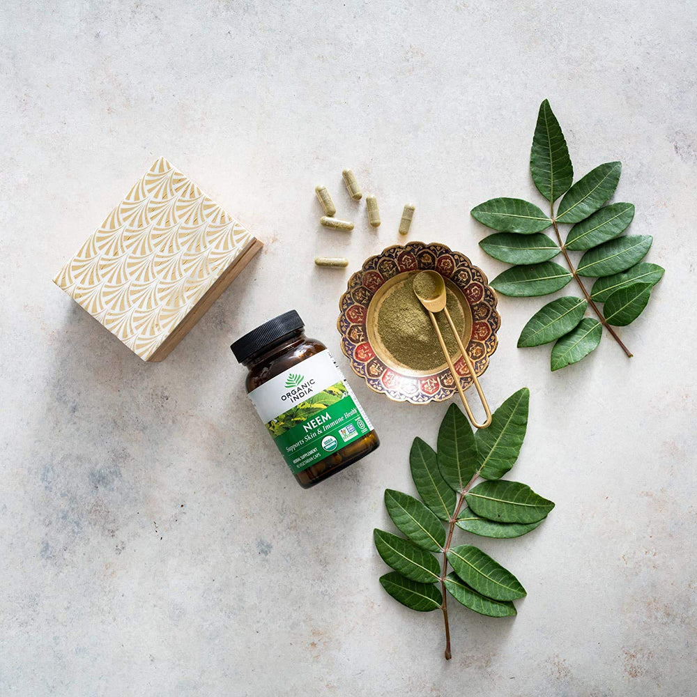 Dried neem leaves from Organic India symbolize natural antioxidants.