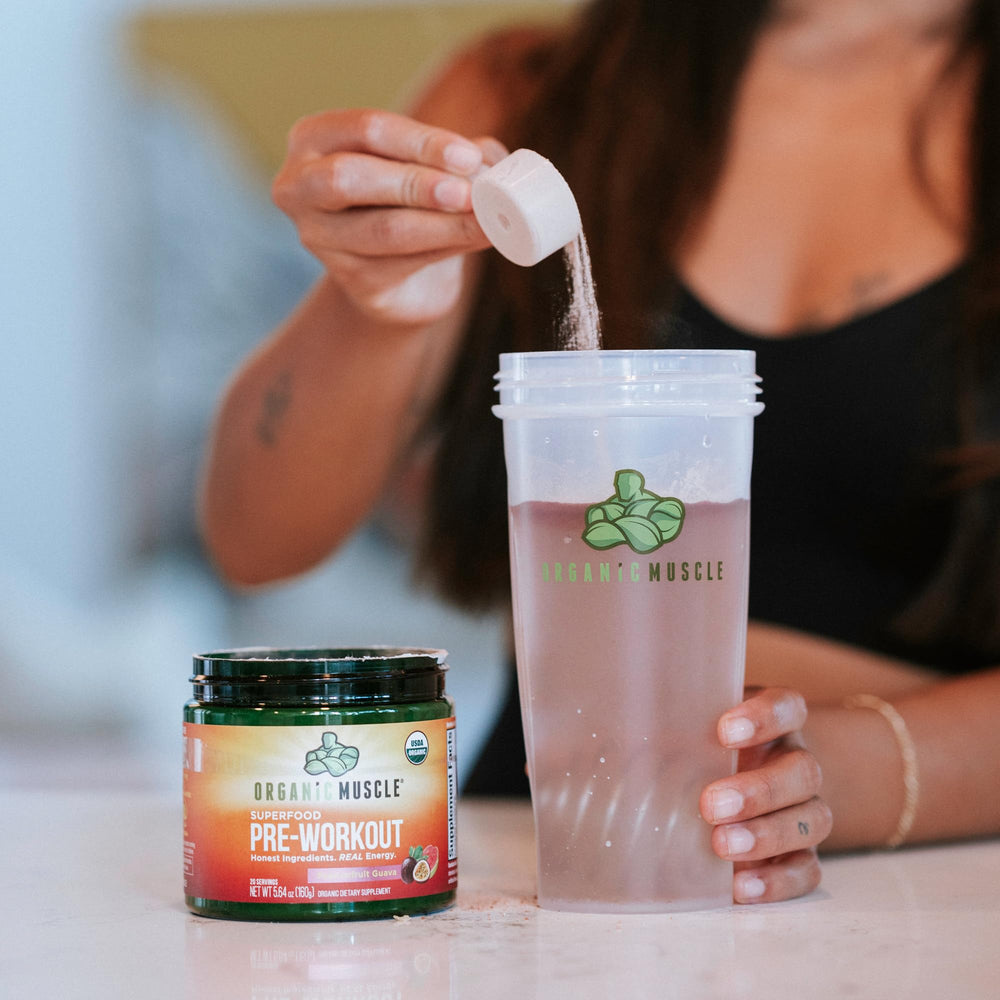 Shaker bottle with Organic Muscle powder demonstrating convenient mixing