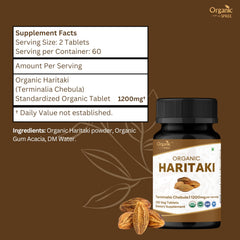 Pouring ORGANIC SPREE Haritaki tablets for a daily routine.