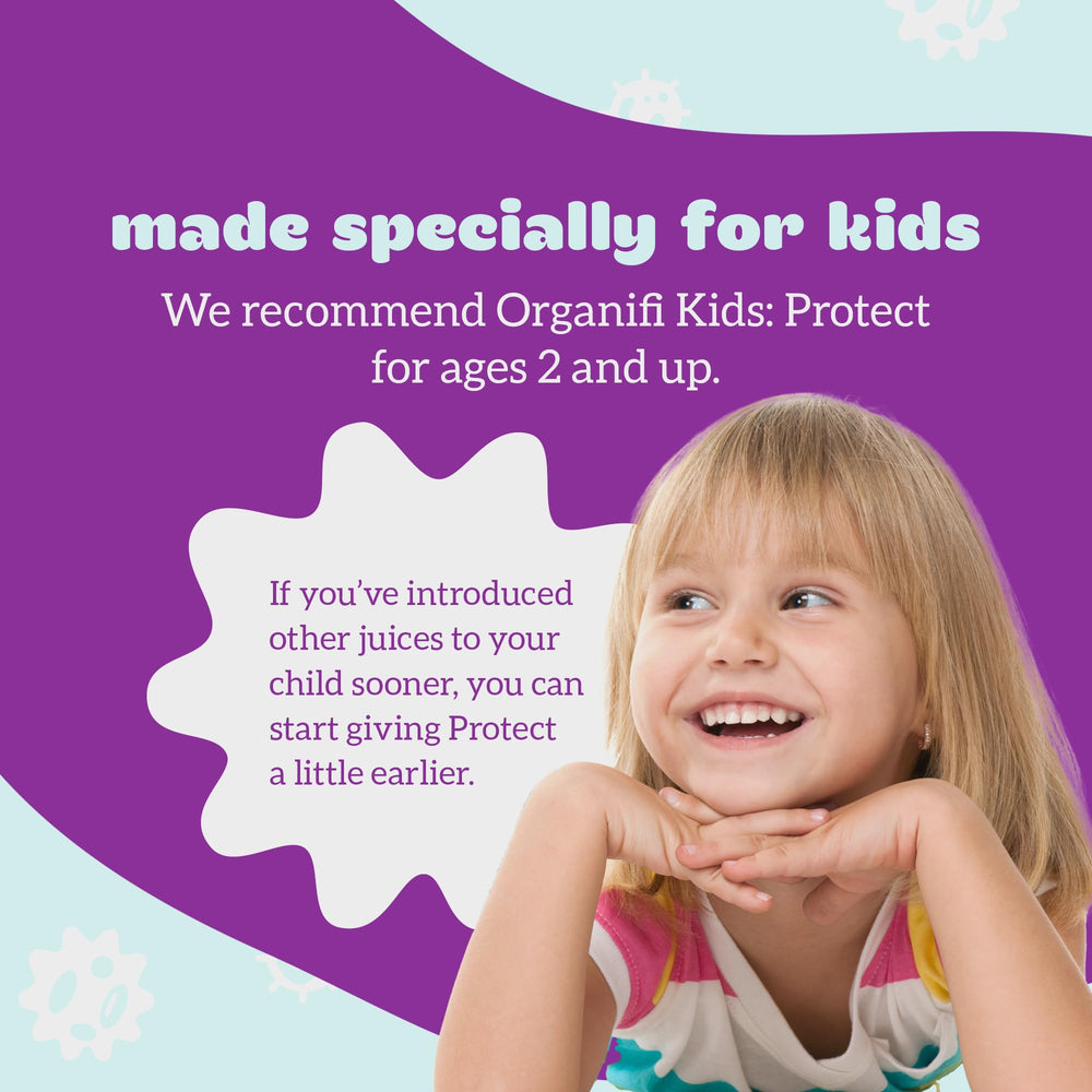Organifi Kids Protect mixing in water glass reveals berry-flavored drink.