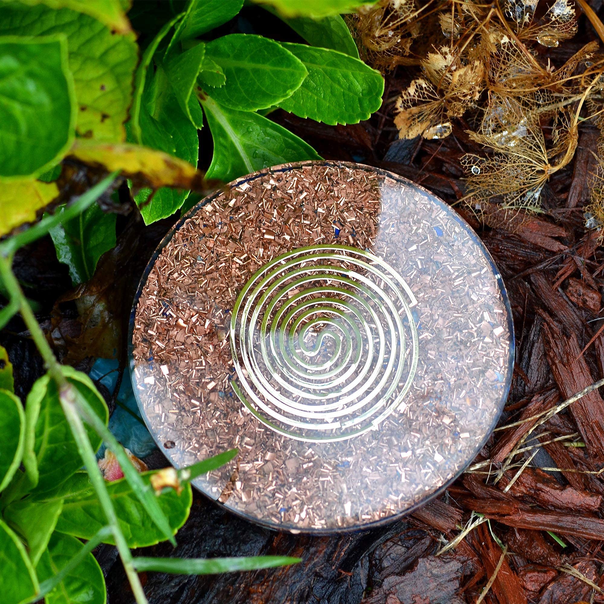 Orgonite Crystal Water Charging Plate showing a glass of water energized