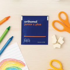 Sipping Orthomol Immun Junior C Plus Tangerine to show kid-friendly consumption.