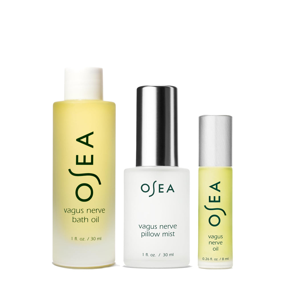 OSEA Vagus Nerve Bath Oil being poured into warm water for a soothing soak